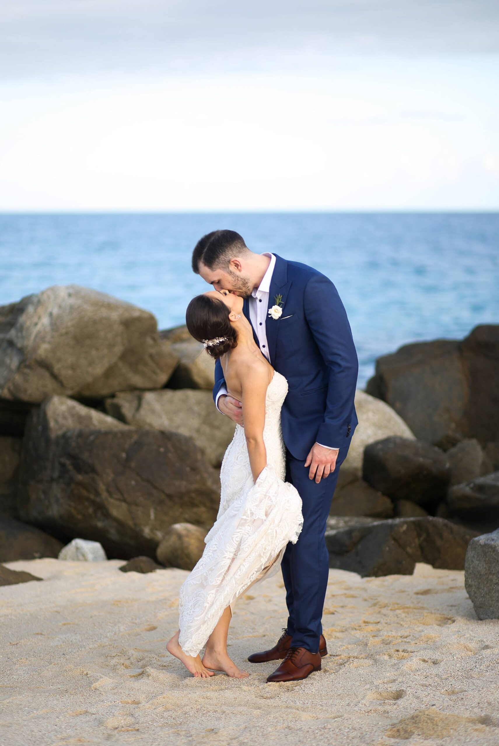Wedding day kiss on beach