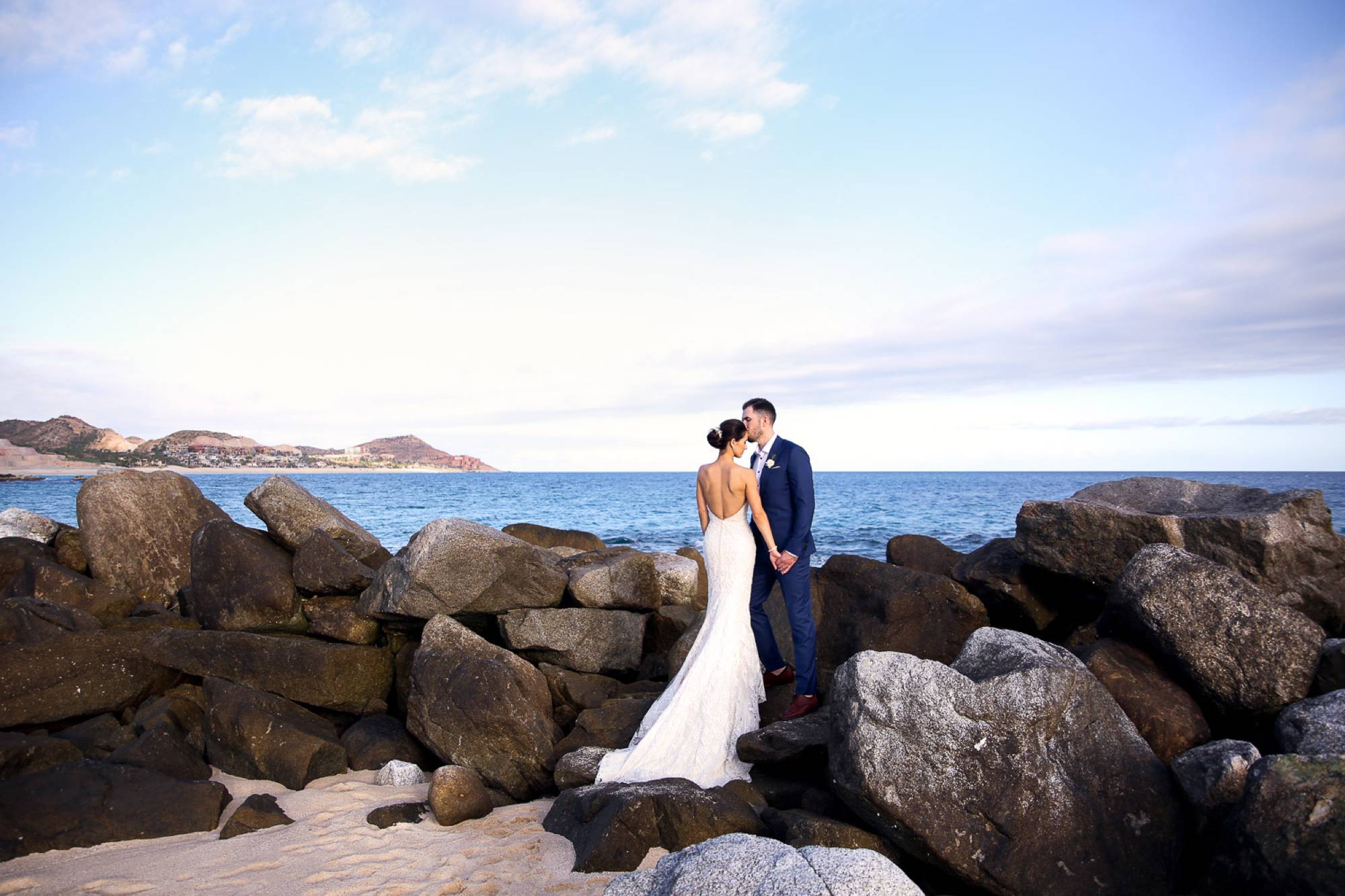 Couple on beach in Mexico, Wedding day, wedding gown and tuxedo