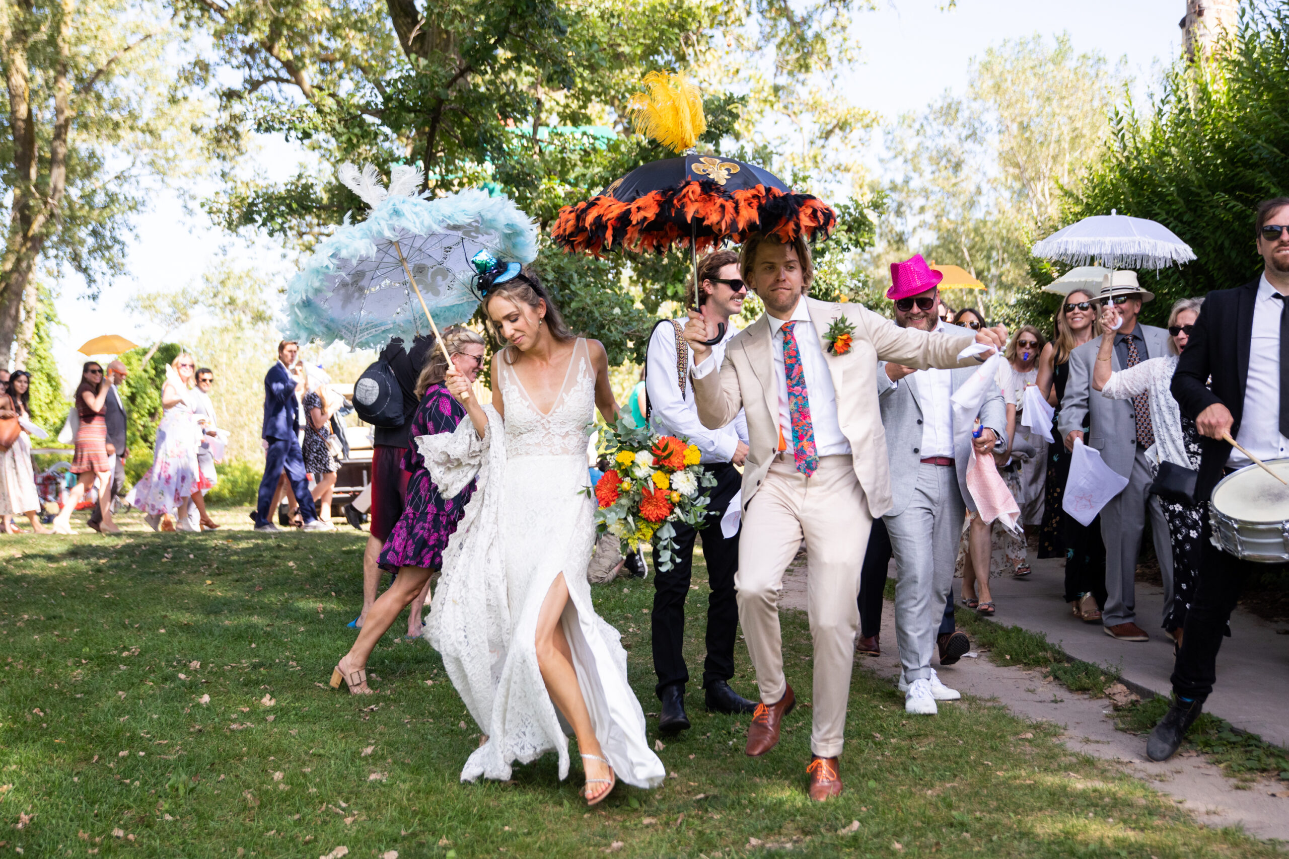 Bride and Groom celebrate wedding ceremony with second line dance parade