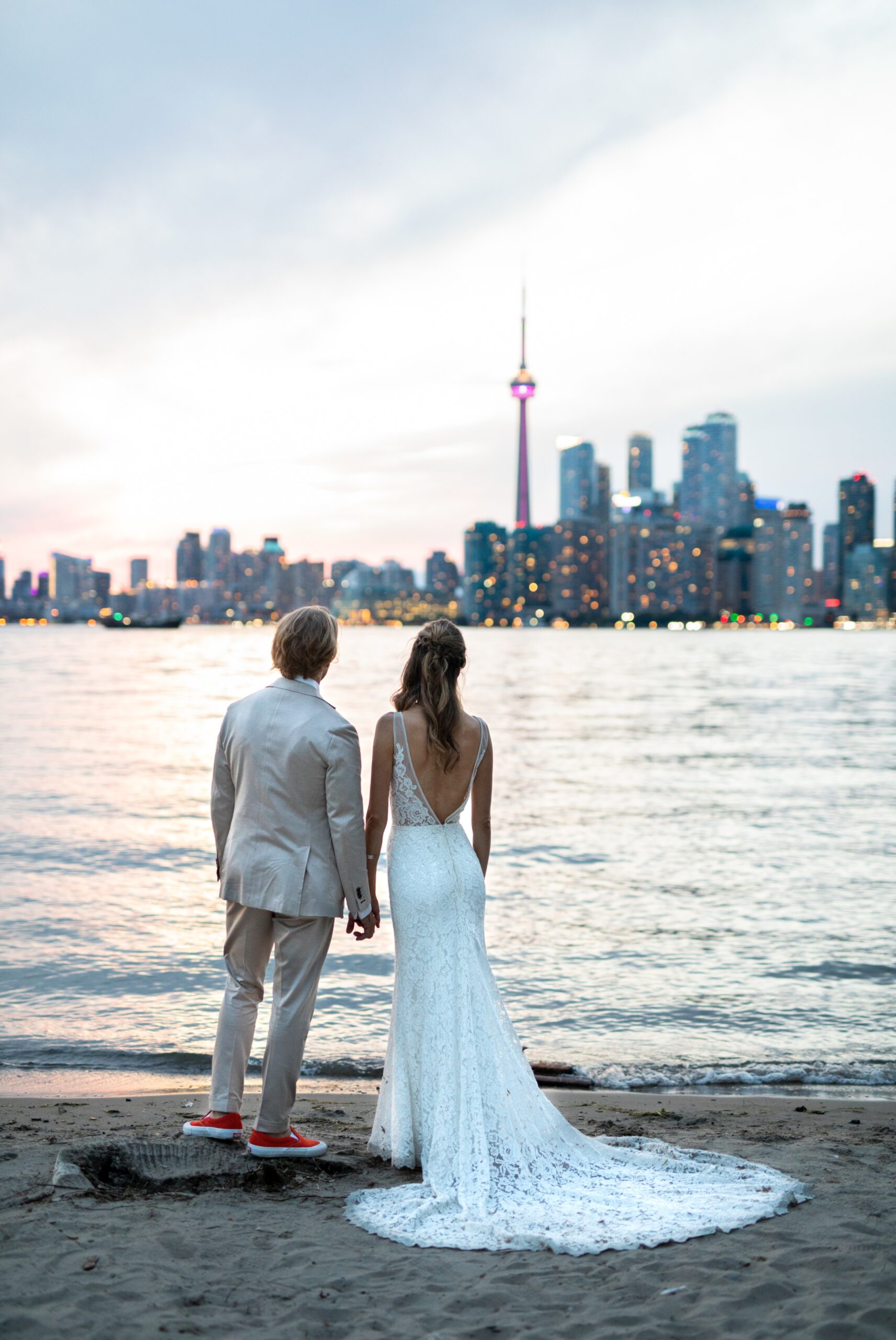CN tower night time, Couple faces Toronto skyline sunset