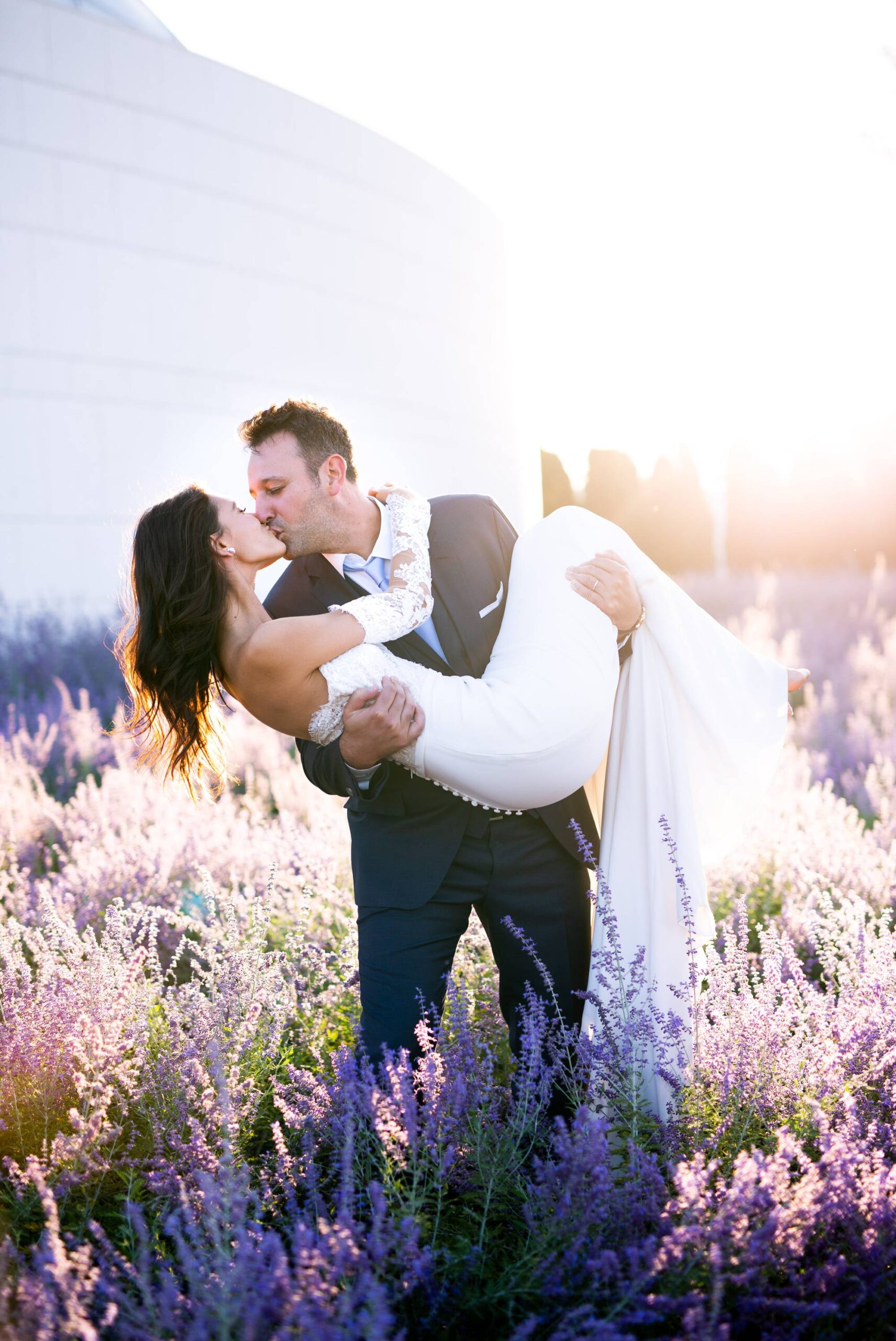 Groom carries bride, Lavender