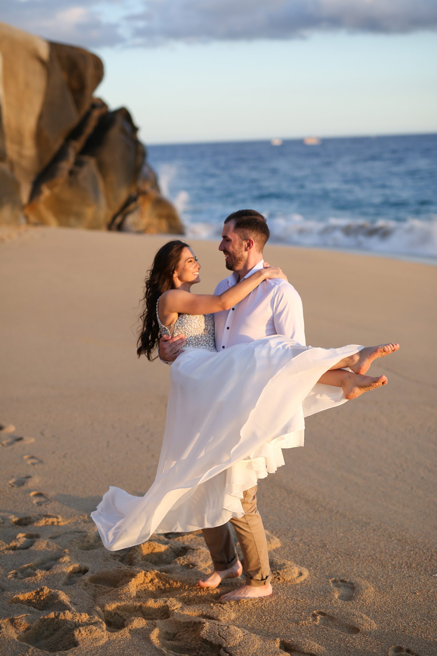 Fun wedding portrait couple twirling beach toronto